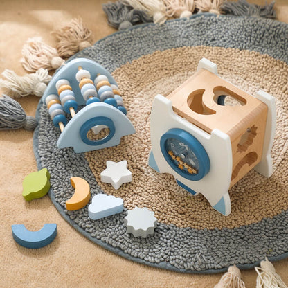 A wooden rocket toy with a shape pairing, a bottom door that opens to take out the input shape block, and a wheel for more fun. Great for cultivating hand-eye coordination. Montessori Learning Educational Gift idea Birthday Christmas Quality Wood Organic Wooden Toys Toddler Baby Board Games Puzzle